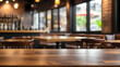 Empty top table of coffee shop or cafe restaurant with blurred abstract light background.