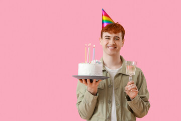 Sticker - Young man with birthday cake and glass of champagne on pink background