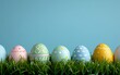 Easter eggs in gentle hues lying on rich greenery