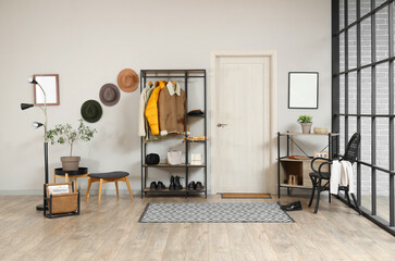 Sticker - Interior of stylish hall with coat rack and door