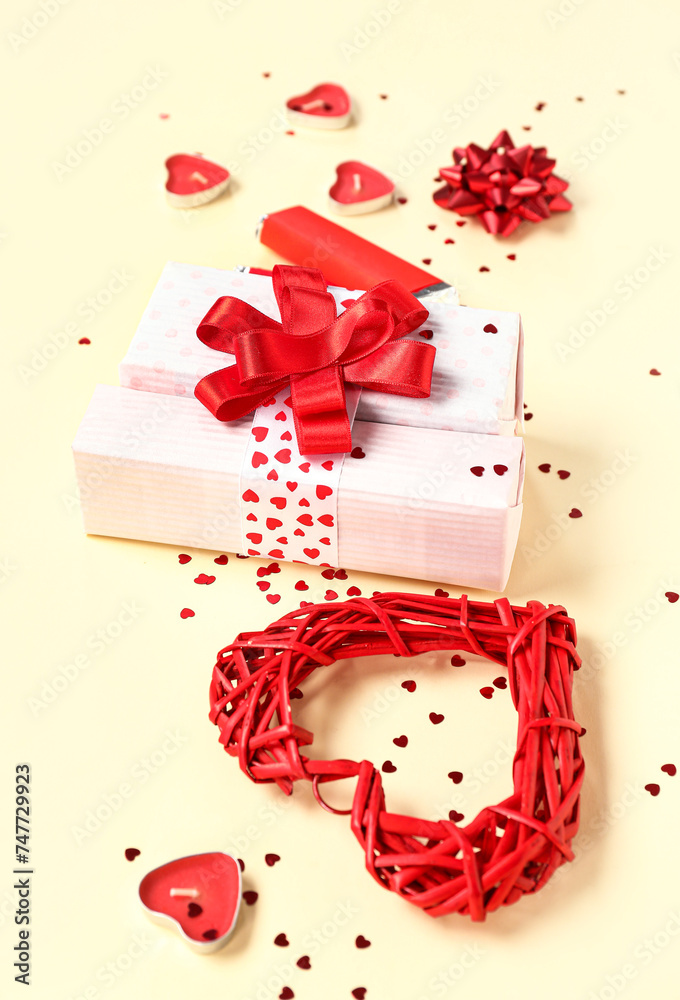 Composition with gift box and decor for Valentine's Day celebration on color background