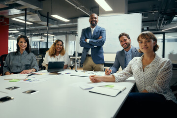 Wall Mural - Group portrait of multiracial business people in businesswear smiling during meeting in office