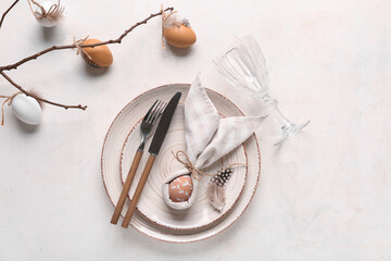 Poster - Beautiful table setting with Easter eggs and tree branch on white background