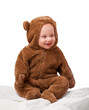 © T. Rose/peopleimages.com - Studio, baby and onesie with costume, bear and toddler with joy and fun. Child, newborn and happiness with adorable, comfort and dressed up infant for development isolated on white background