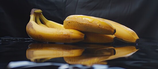 Poster - A bunch of ripe bananas is sitting on top of a table. The bananas are yellow and ready to be eaten, with no other objects around them.