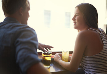 Sticker - Talk, happy couple and drinking beer in pub, relax and leisure together in restaurant with alcohol. Smile, man and woman in conversation at bar for connection, relationship or bonding on date at club