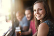 Portrait, smile and a woman at pub to relax, cheerful or positive facial expression for leisure at restaurant. Face, bar or happy female person or young customer in casual clothes at cafe for alcohol