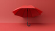 red umbrella isolated on red background