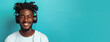 Panoramic header with a young african american man enjoying music with headphones, looking at camera