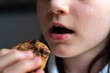 © Julia - Girl Eating Chocolate Cookie: Close-Up