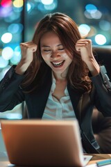 Aufkleber - A woman sitting in front of a laptop computer. Suitable for business or technology concepts