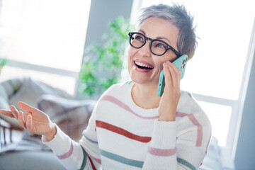 Poster - Photo of cute excited woman dressed striped sweater eyewear communicating modern gadget indoors house home room