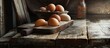 A rustic wooden table is covered with a variety of fresh eggs, ranging from white to brown. The eggs are neatly arranged and ready to be used for cooking or baking.
