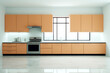 Sleek kitchen with orange cabinetry and a minimalist design.