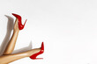 © marcink3333 - Isolated female legs in red high heels. Studio shoot.