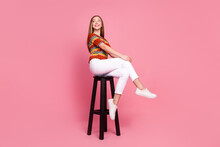 Full Size Portrait Of Cheerful Creative Girl Sit Chair Look Empty Space Imagine Isolated On Pink Color Background