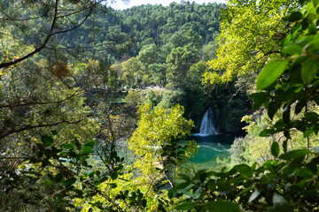 Krka National Park, Split, Croatia. Waterfall surrounded by green landscape and forest. Located in the region of Dalmatia. 