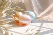 Decorative easter eggs on sunlit background with shadow