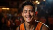 Asian Basketball player smile on blur basketball field