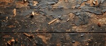 A Detailed View Of A Piece Of Wood With Peeling Paint, Revealing The Texture Of Burnt Wood And Scattered Wood Shavings.