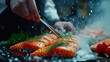 Sea cuisine, Professional cook prepares pieces of red fish, salmon, trout with vegetables.