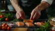 Sea cuisine, Professional cook prepares pieces of red fish, salmon, trout with vegetables.