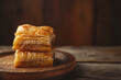 © Rangga Bimantara - baklava dessert on wooden plate with dark background. traditional turkish dessert. ramadan food concept