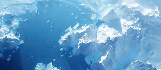 Wall Mural - a cold winter background reveals an aerial perspective of a massive iceberg floating in the ocean at