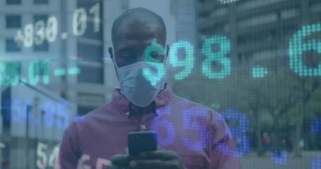 Sticker - Animation of financial data processing over african american man in face mask using smartphone