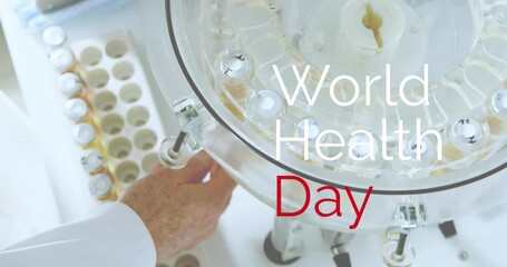 Sticker - Animation of world health day text over caucasian male scientist collecting test tubes