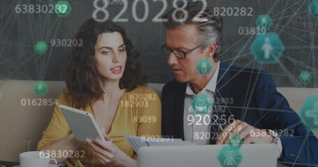 Poster - Animation of medicine icons and data processing over caucasian business people discussing work