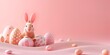 Animated orange bunny with large ears among a variety of pastel-colored Easter eggs with polka dots, set against a soft pink backdrop suitable for an Easter banner or greeting card