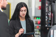 © Irin - A Professional female engineer and Male CEO are working on PLC Control panel CNC machine. Expertise and technician repairman is maintenance, programming, and improve the automatic innovation machinery