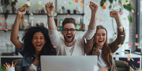 Rejoicing happy emotional people. Excited coworkers celebratingwith  in a fun office environment