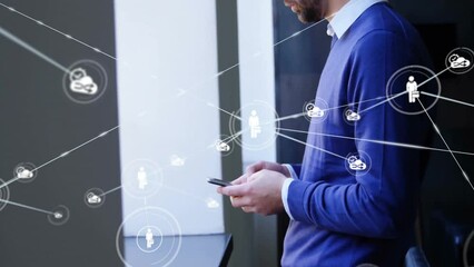 Poster - Animation of network of connections with icons over caucasian businessman using smartphone