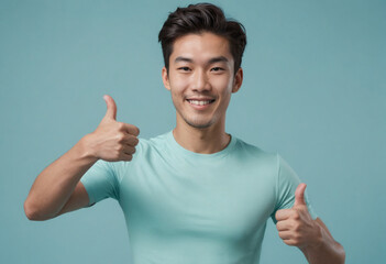 Wall Mural - A confident man in a teal t-shirt gives a thumbs up. His bright expression and athletic build suggest health and positivity.