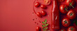 A bottle of ketchup and a tomato on a red background. Popular condiment for burgers and fries. Top view space to copy.