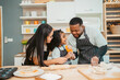 © chokniti - happy child family with father or mother cooking fun together for bakery bread meal in kitchen, young African little kid daughter girl and parent in love childhood lifestyle at home for food homemade