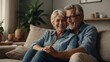 © LIFE LINE - Happy mature husband and wife sit rest on couch at home , show care affection, smiling senior loving couple relax on sofa , enjoy tender romantic family weekend together