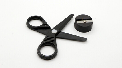 Black scissors with and black pencil sharpener a small size