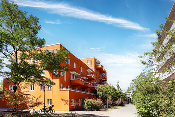 Residential area with ecological and sustainable green residential buildings, low-energy houses with apartments and green courtyard