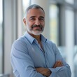 © Henryzoom - Portrait of an Arab male businessman 50-60 years in a suit against the background of an office