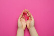 © New Africa - Woman with pink ribbon on color background, top view. Breast cancer awareness