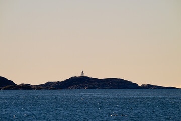 Wall Mural - Old wooden beacon on a small island.