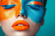 Creative colorful bright makeup in orange and blue shades. Body art, lip gloss. Fashion concept