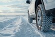 Winter tire on an suv navigating a snowy road Emphasizing safety and reliability in harsh winter conditions for family travel and outdoor adventures