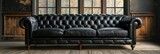 Fototapeta Tęcza - Black leather couch positioned in front of a window