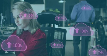 Poster - Animation of clouds with percents over caucasian businesswoman using tablet in office