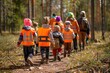 © artemstepanov - Kindergarten in Forest, Children Walking with Tutors in Wild Park, Finnish Forest School, Forest Kindergarten