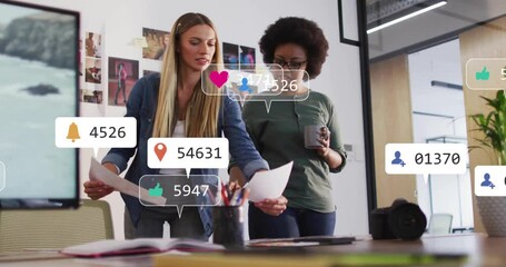 Poster - Animation of media icons over diverse female colleagues discussing work in office